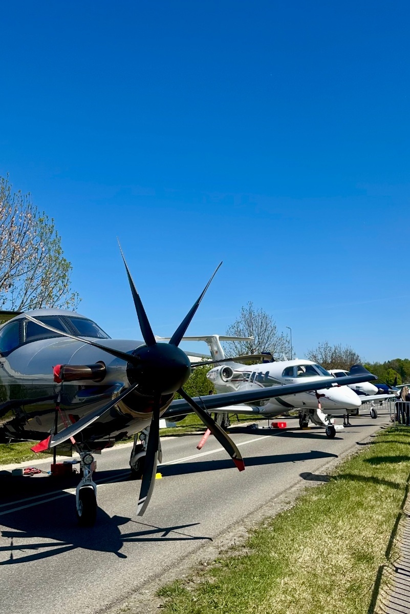 representatives of the Jets & Helicopters company at an exhibition in Friedrichshafen